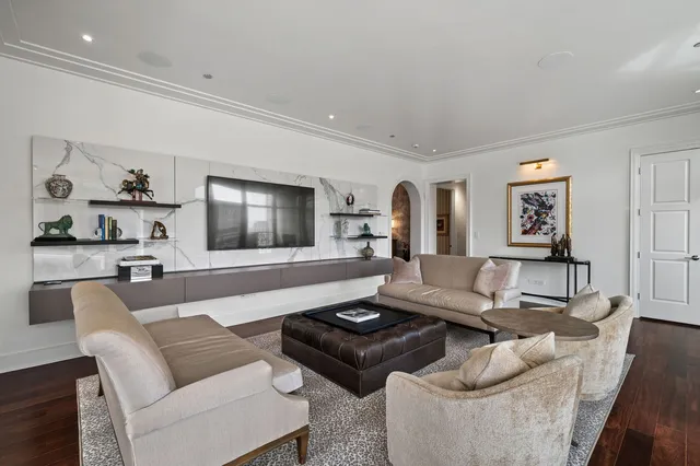 a living room with furniture or couch and a large window