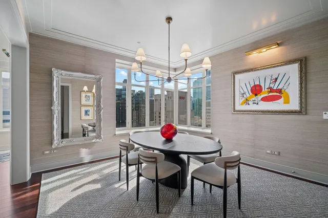 a dining room with furniture and window