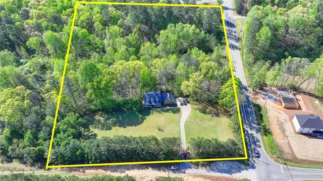 an aerial view of a house having swimming pool