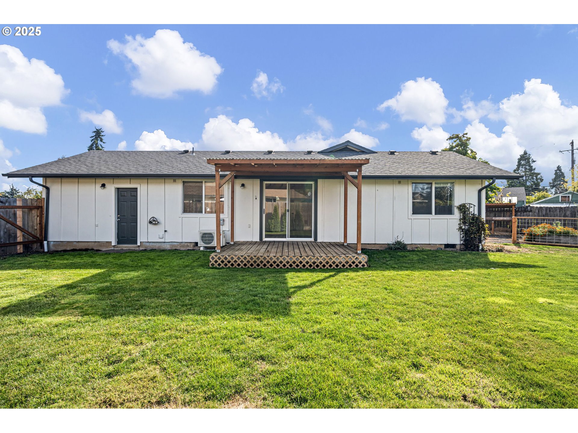 872 West N Street Springfield, OR 97477 - Photo 22 of 28 a view of a house with a backyard