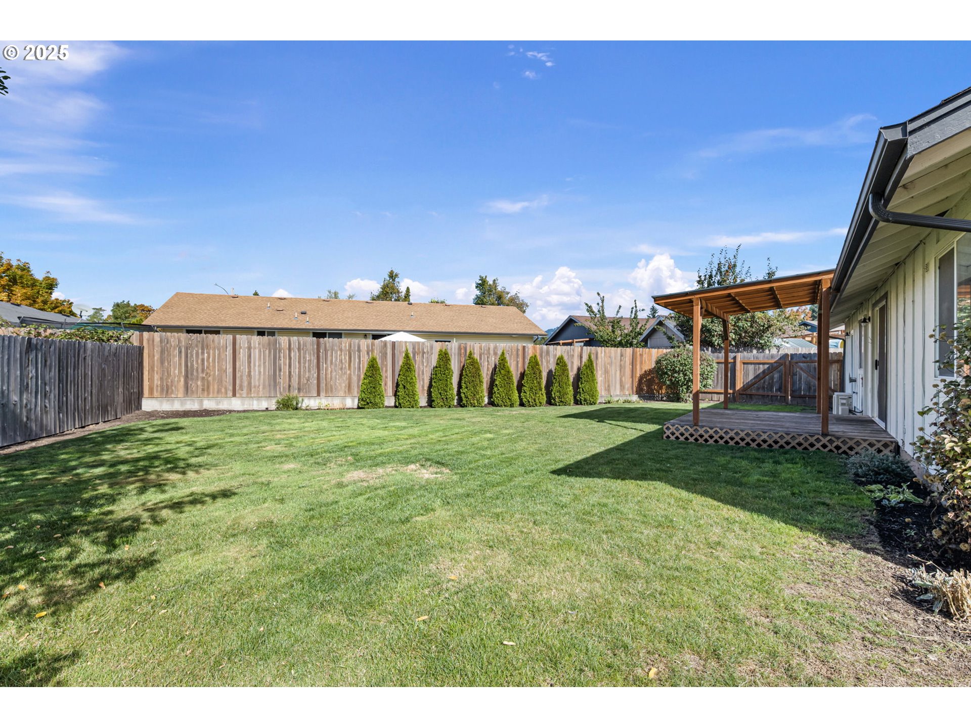 872 West N Street Springfield, OR 97477 - Photo 25 of 28 a view of a house with a yard