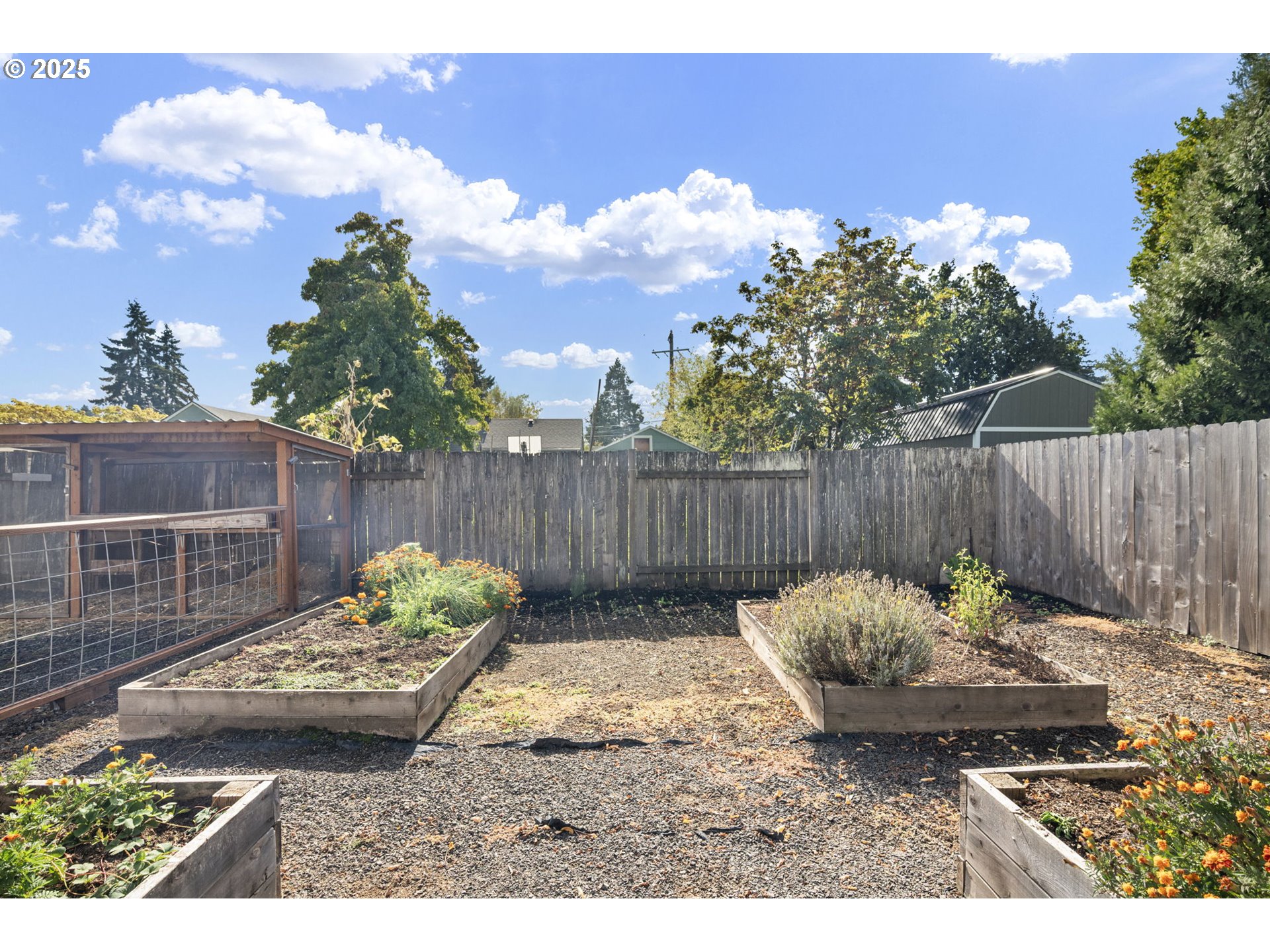 872 West N Street Springfield, OR 97477 - Photo 27 of 28 a backyard with table and chairs and potted plants