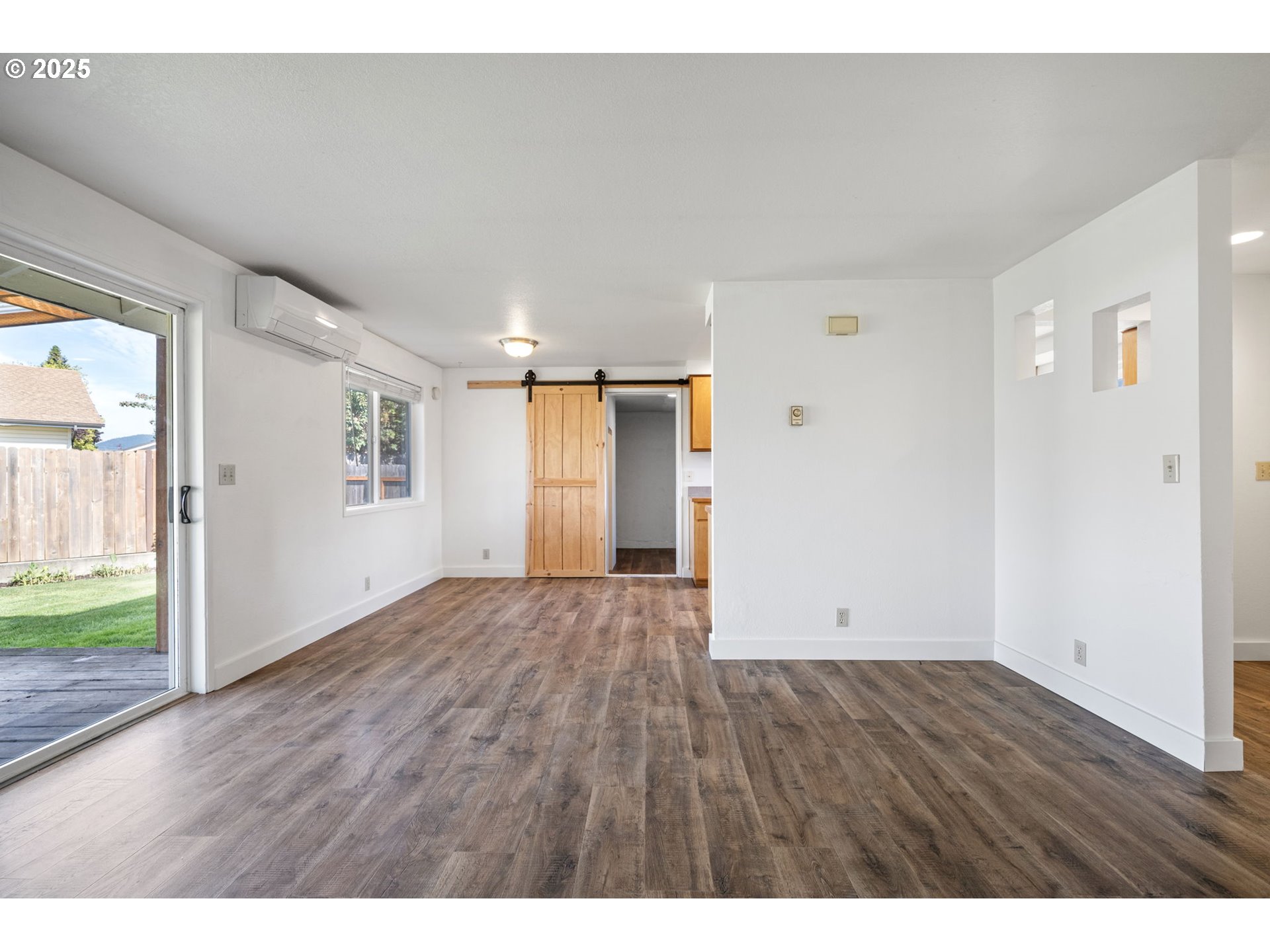 872 West N Street Springfield, OR 97477 - Photo 4 of 28 a view of an empty room with wooden floor