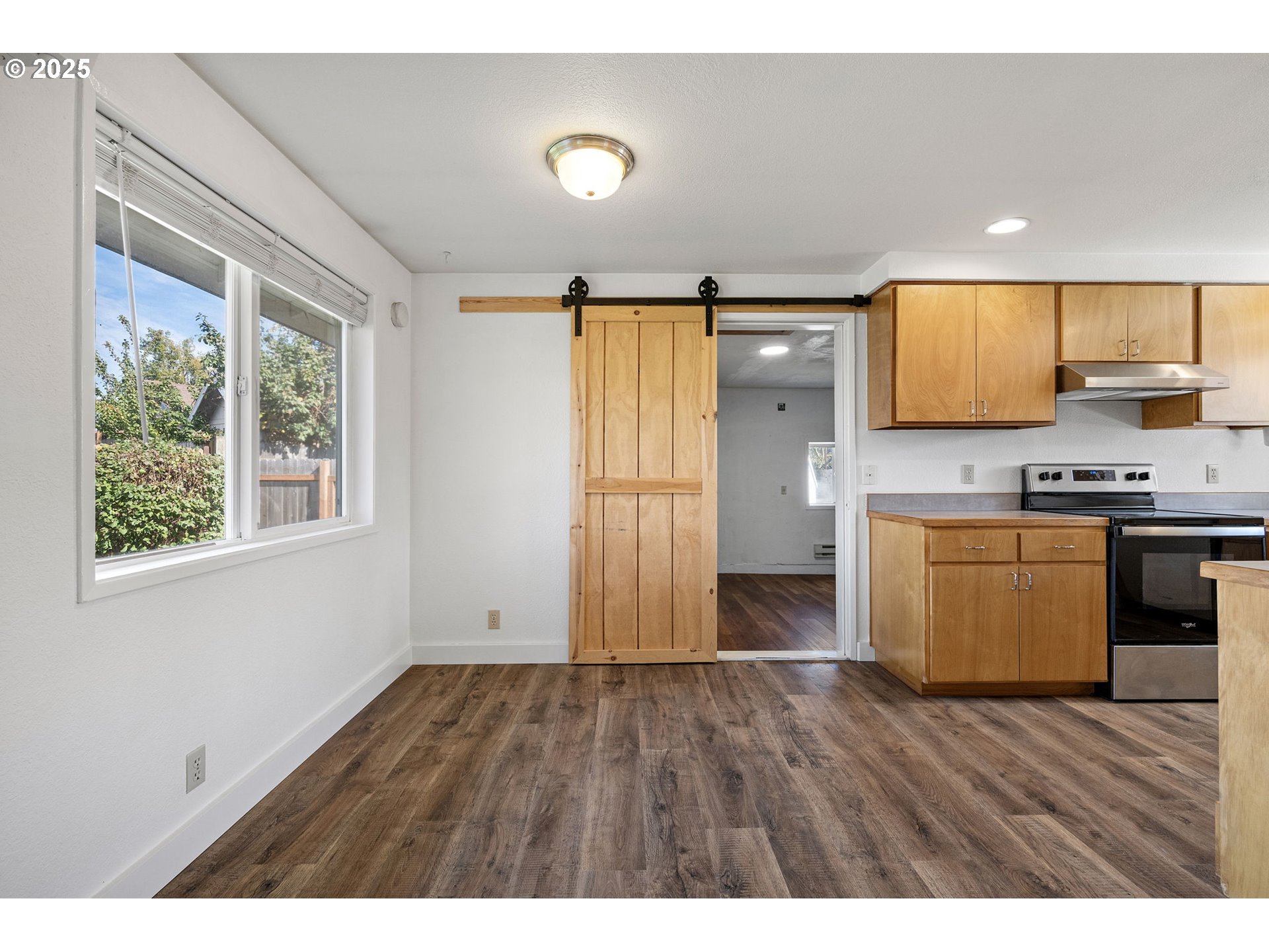 872 West N Street Springfield, OR 97477 - Photo 5 of 28 a view of kitchen with wooden floor and electronic appliances