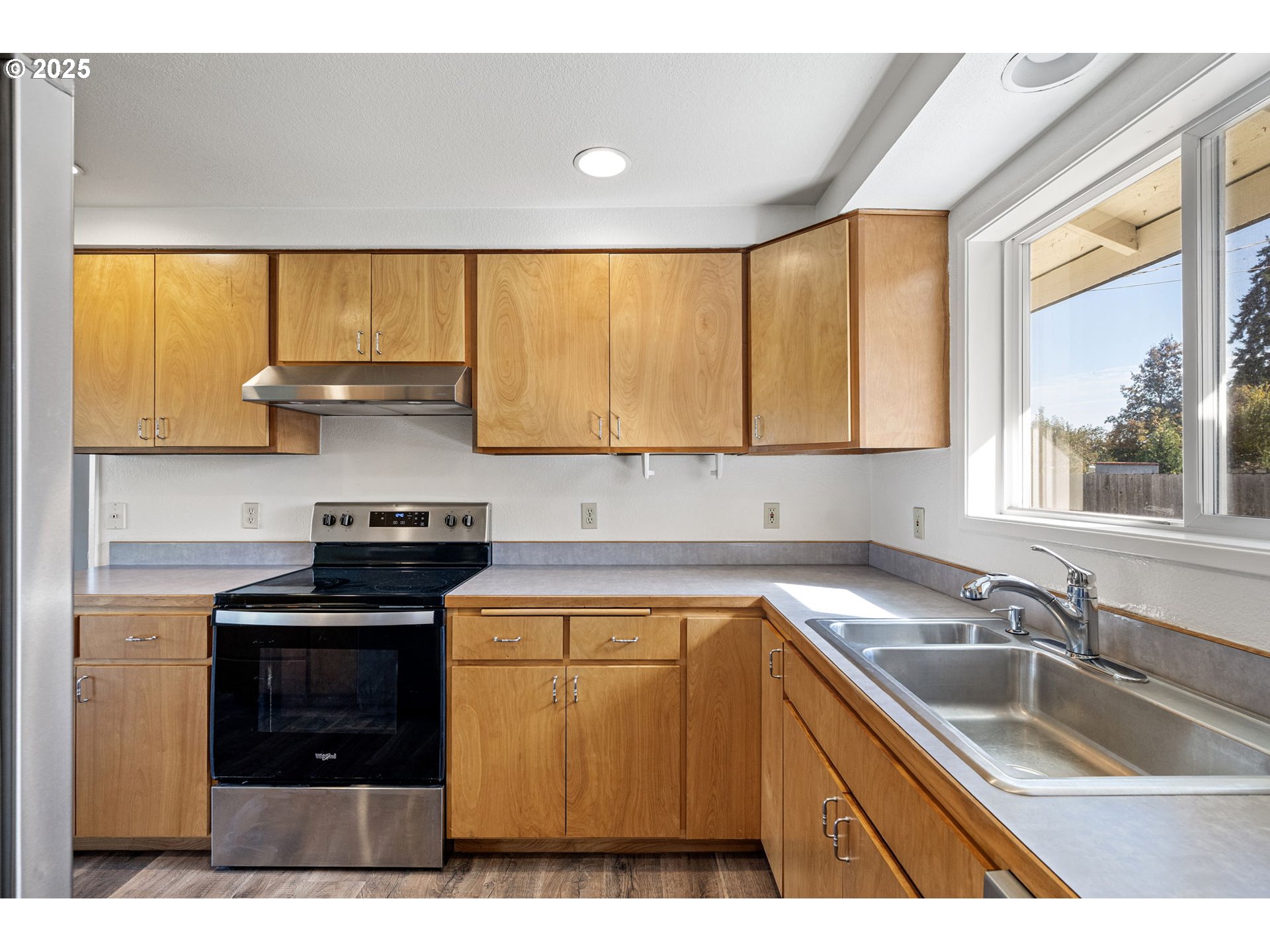 872 West N Street Springfield, OR 97477 - Photo 8 of 28 a kitchen with a sink a stove and cabinets