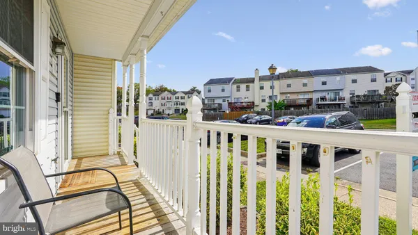 a view of a balcony with furniture
