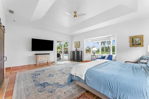 a bathroom with a bathtub and a window