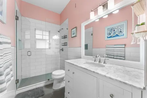 a view of a swimming pool with a table and chairs