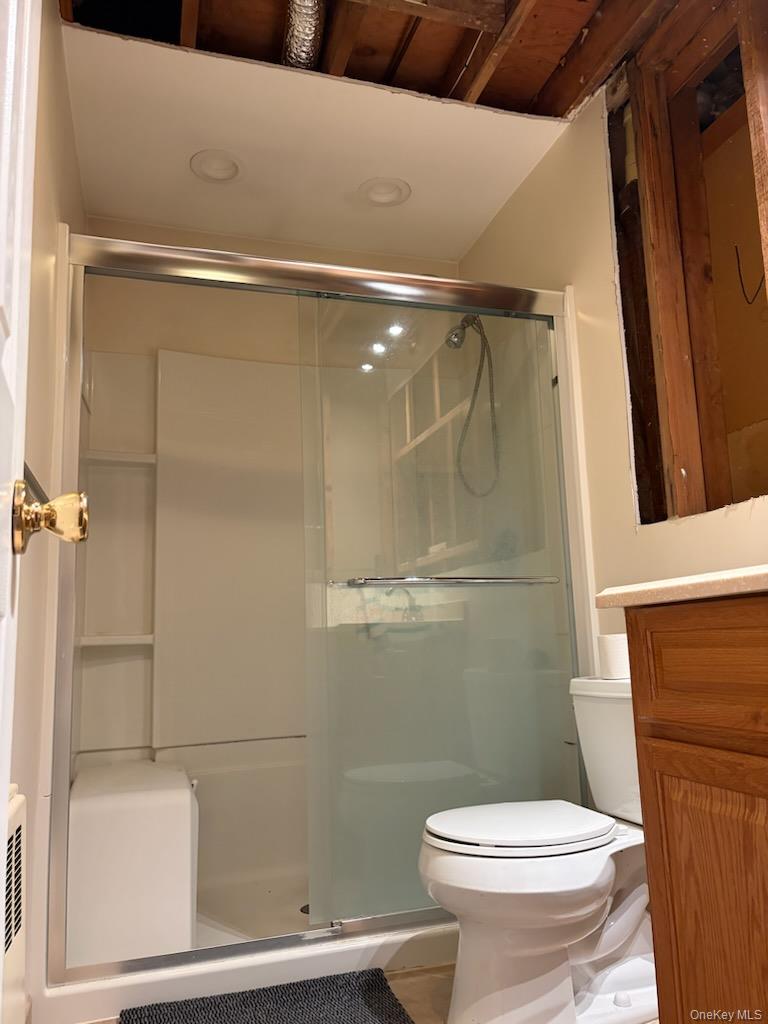 499 Old Country Road Deer Park, NY 11729 - Photo 4 of 21 a bathroom with a shower and a toilet
