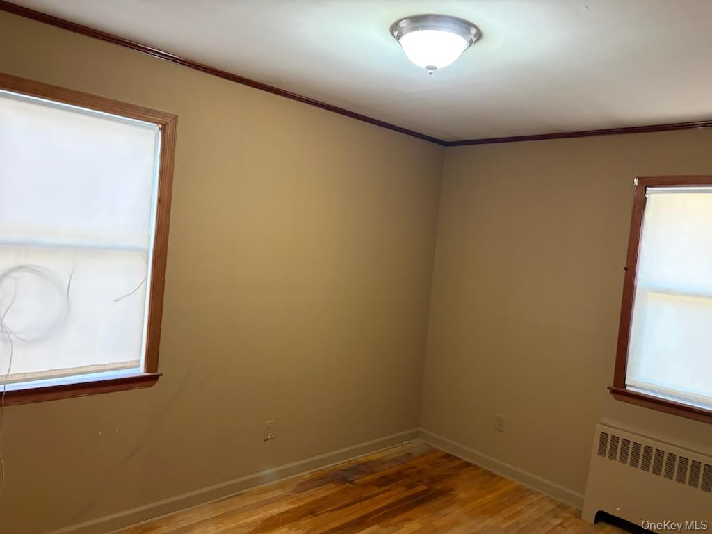 499 Old Country Road Deer Park, NY 11729 - Photo 5 of 21 a view of room with window and wooden floor