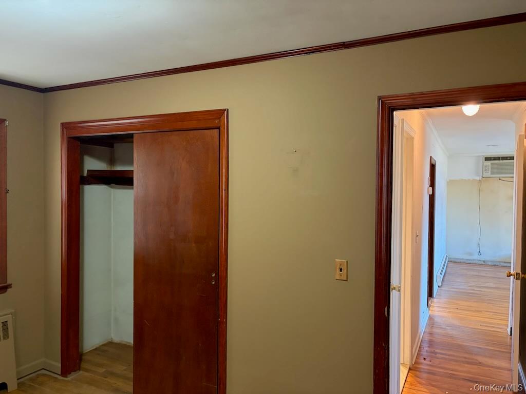 499 Old Country Road Deer Park, NY 11729 - Photo 6 of 21 a view of a hallway with wooden floor