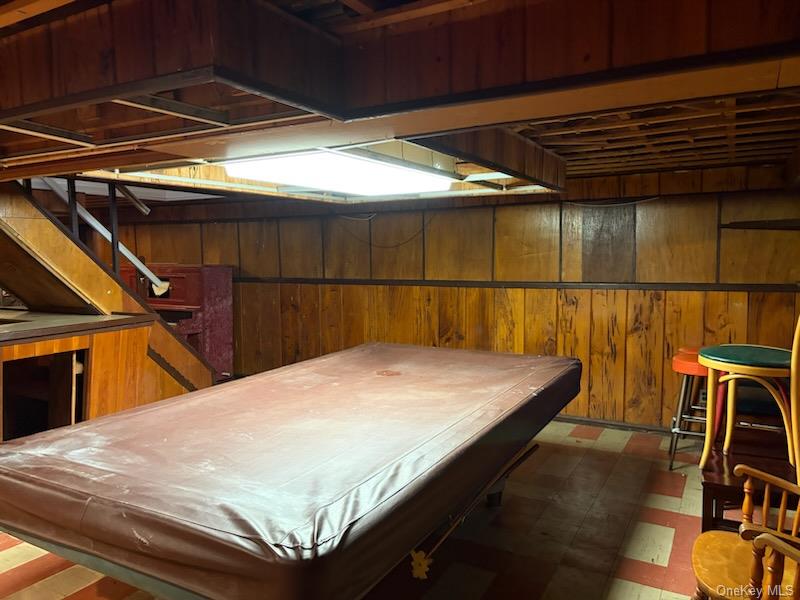 499 Old Country Road Deer Park, NY 11729 - Photo 10 of 21 a bed sitting in a bedroom next to a window