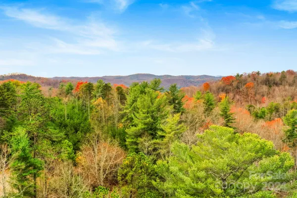a view of mountain with sunset