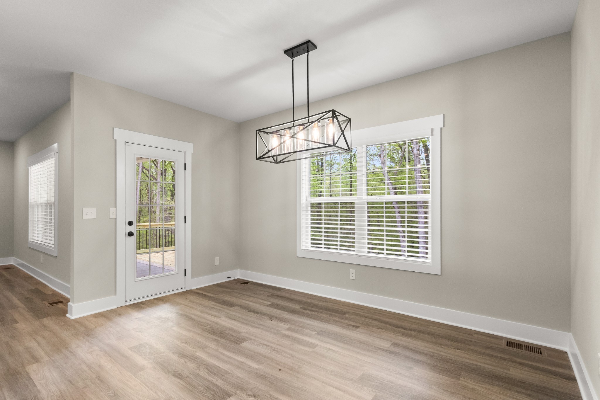 1228 Boulder Pass Road Clarksville, TN 37040 - Photo 9 of 26 a view of empty room with wooden floor and fan