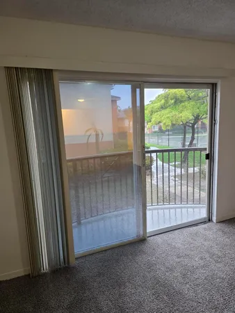 a view of a room with large windows