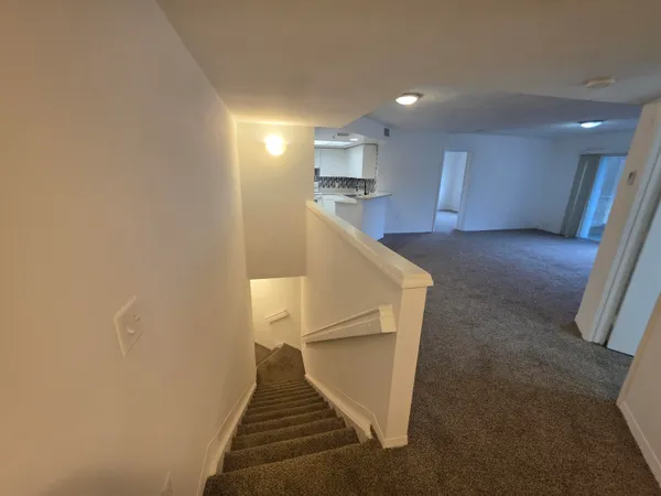 a view of entryway and kitchen