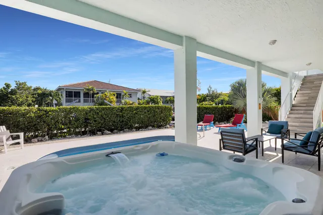 a outdoor space with patio the couches and a potted plant on the table