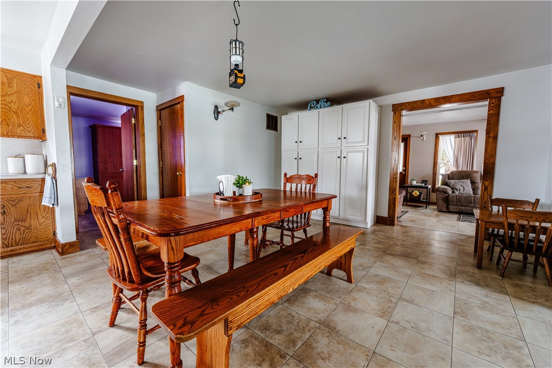 16350 Nauvoo Road Middlefield, OH 44062 - Photo 11 of 50 Dining area featuring light tile patterned flooring