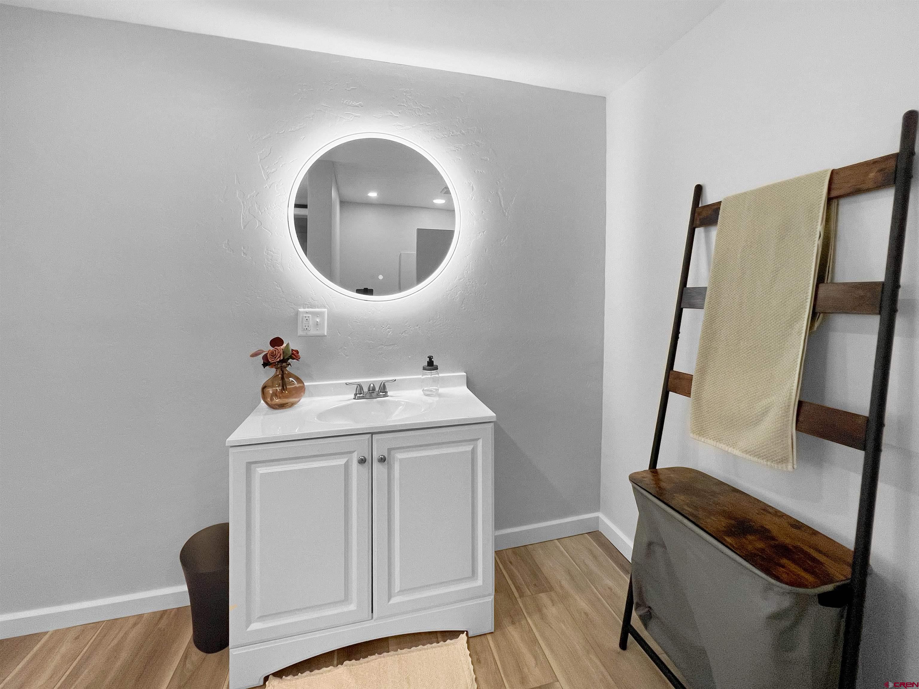 1002 East Carpenter Street Cortez, CO 81321 - Photo 20 of 42 a utility room with wooden floor washer and dryer