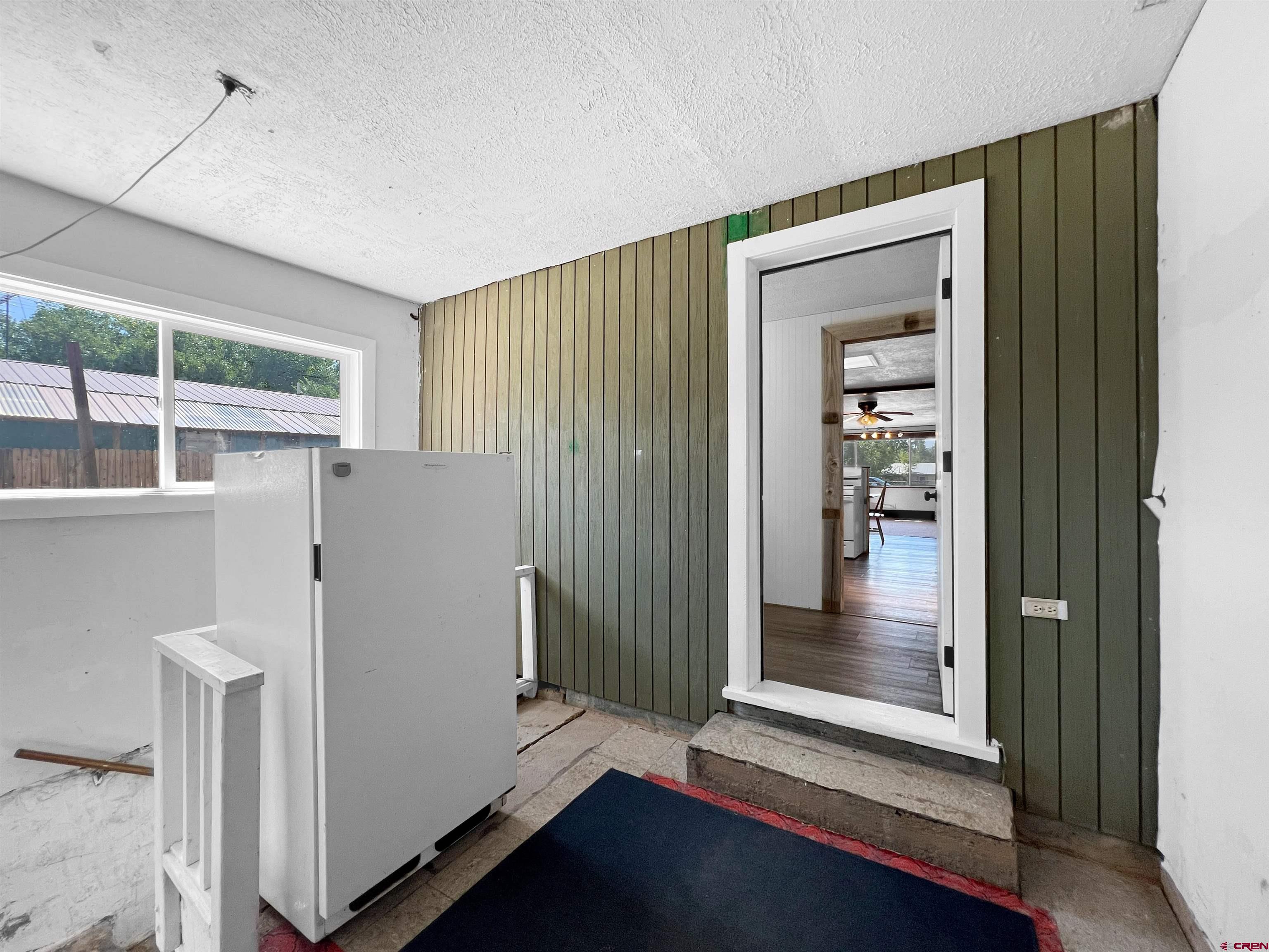 1002 East Carpenter Street Cortez, CO 81321 - Photo 28 of 42 a view of a hallway with front door