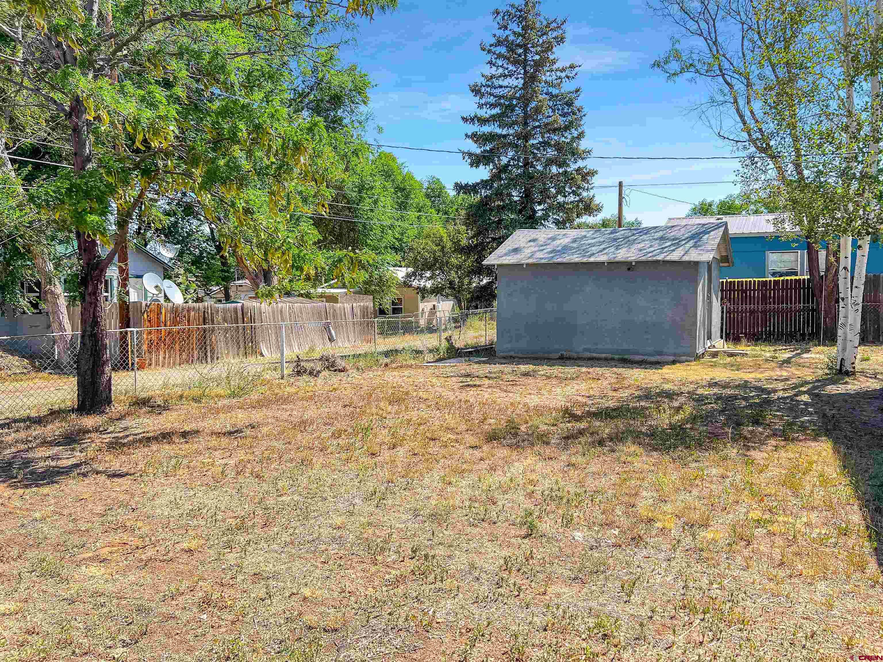 1002 East Carpenter Street Cortez, CO 81321 - Photo 36 of 42 a view of a backyard of the house