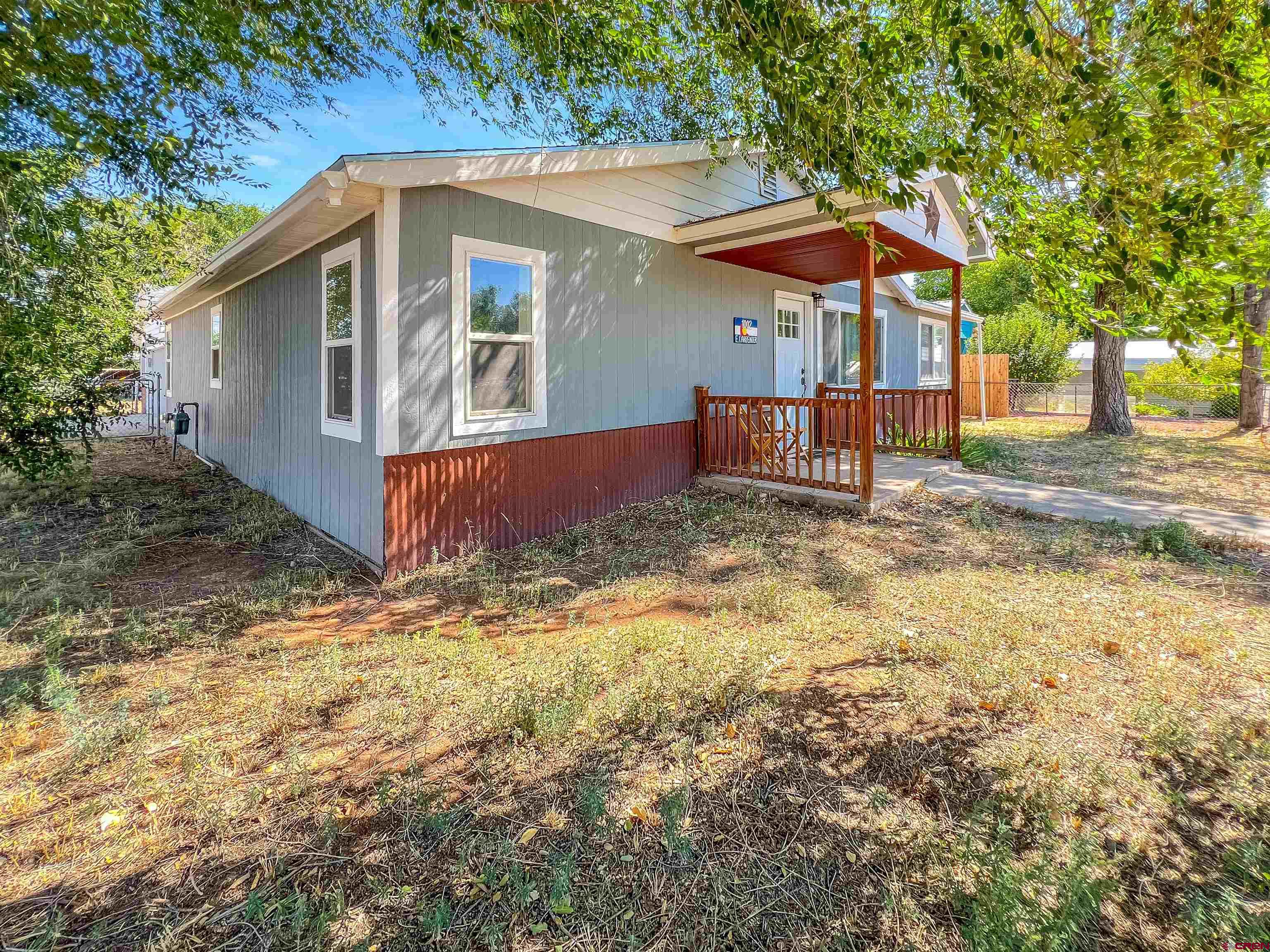 1002 East Carpenter Street Cortez, CO 81321 - Photo 41 of 42 a view of a house with a yard