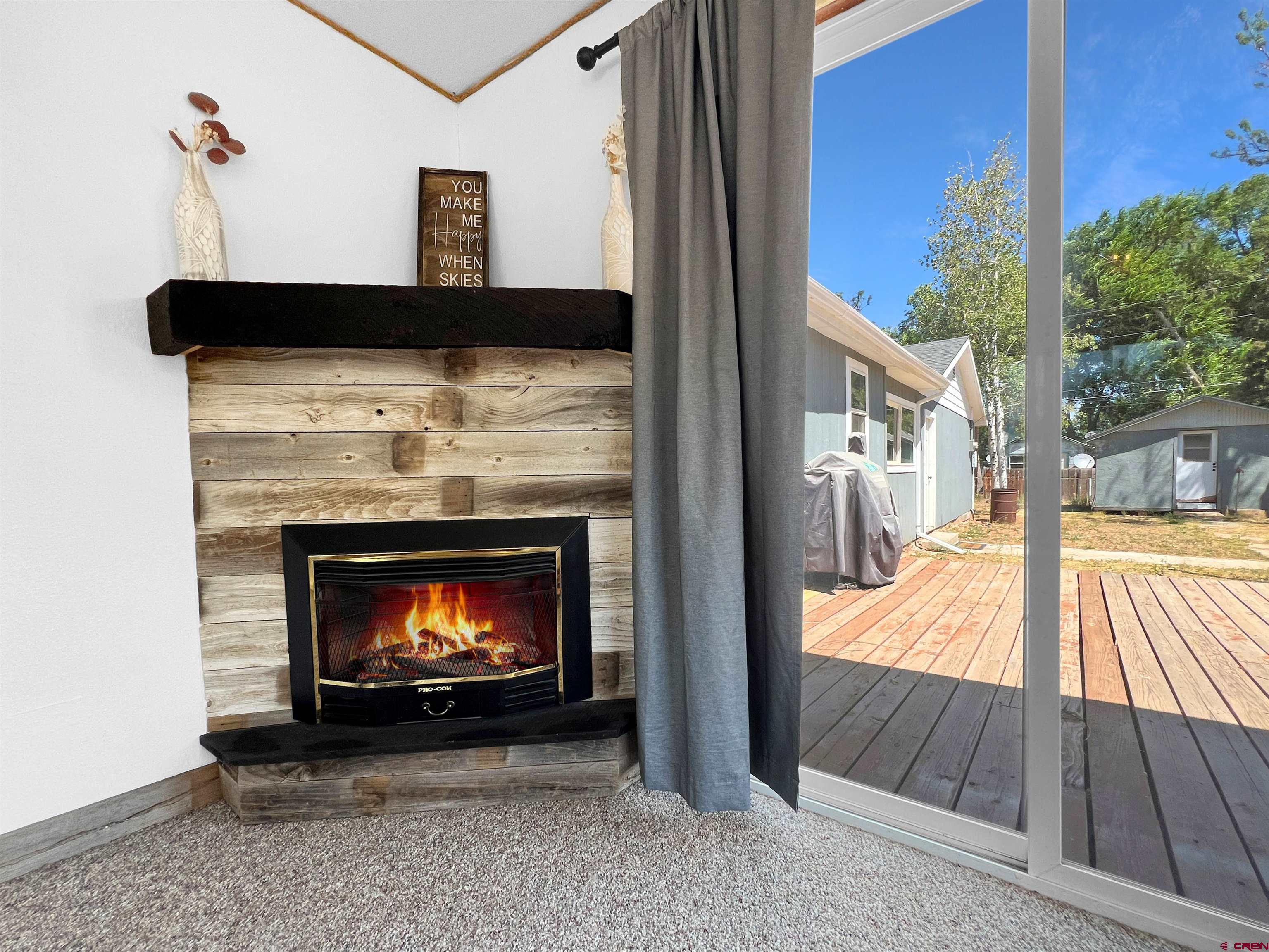 1002 East Carpenter Street Cortez, CO 81321 - Photo 6 of 42 a living room with a fireplace in it
