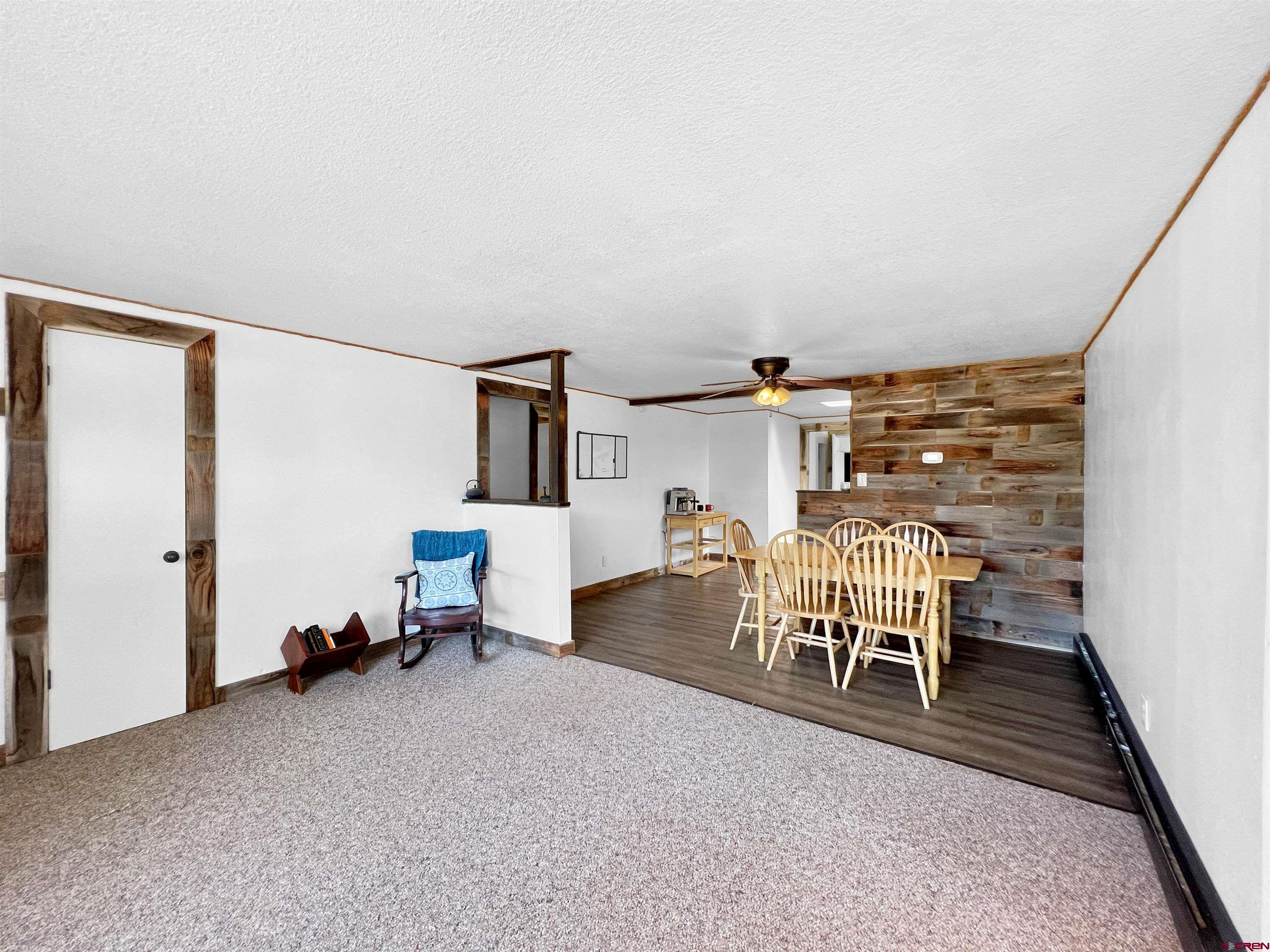 1002 East Carpenter Street Cortez, CO 81321 - Photo 8 of 42 a dining room with furniture and a window