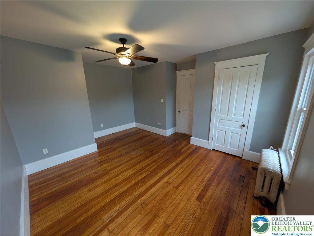 1027 Walnut Street, Unit 3 Allentown, PA 18102 - Photo 6 of 14 a view of empty room with wooden floor