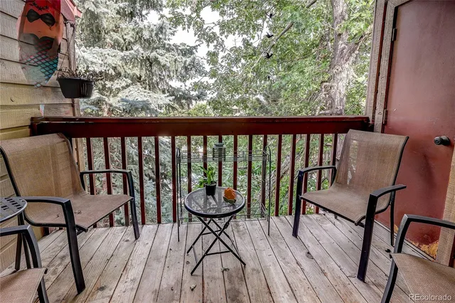 a view of a chairs and table on the deck