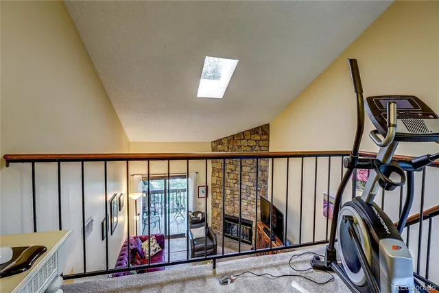 a view of a hallway with wooden furniture