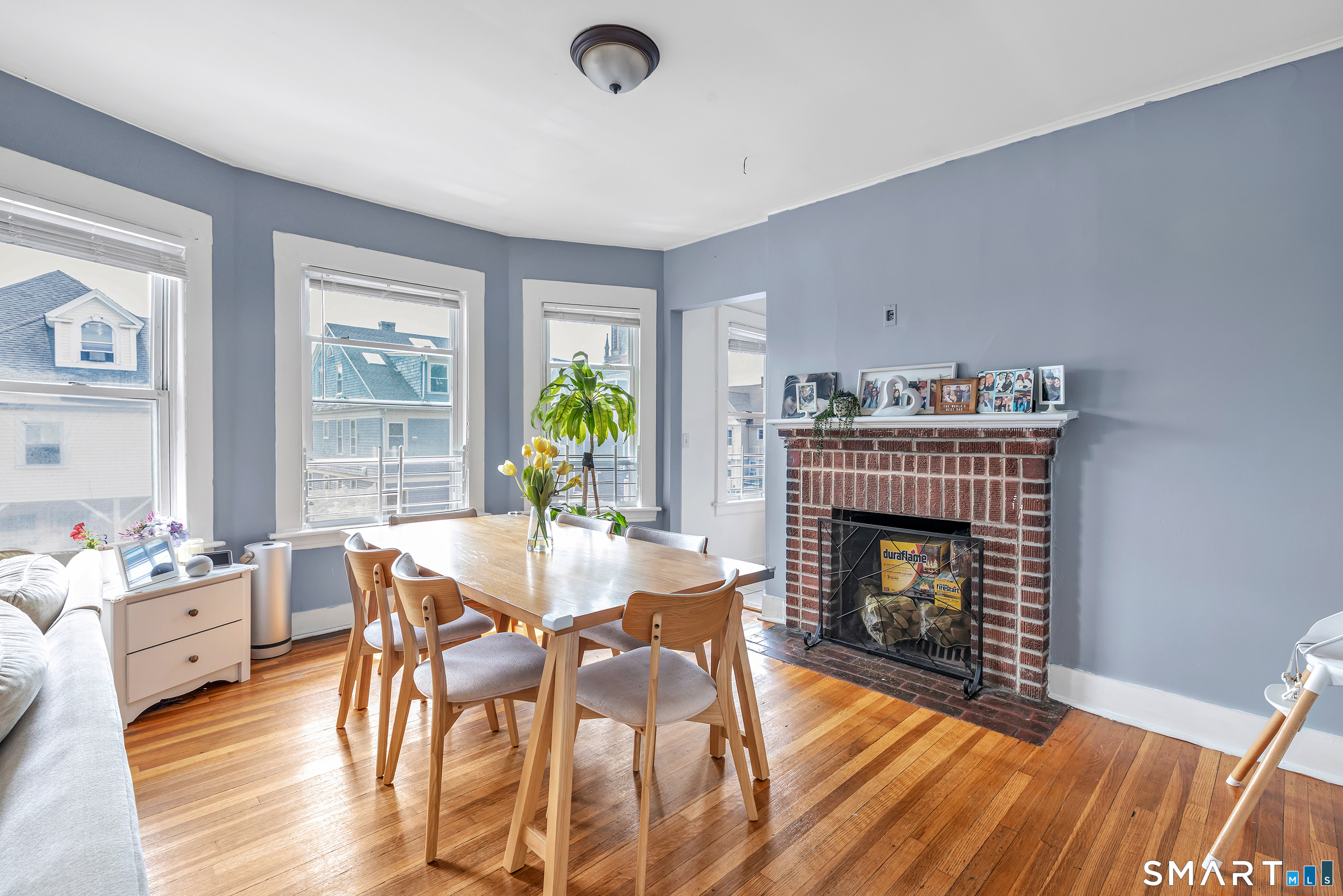 189 Wells Street Bridgeport, CT 06606 - Photo 6 of 40 2nd Floor - Offers 1389 sq ft -Shared LR & DR has operable wood burning fireplace, hardwood floors