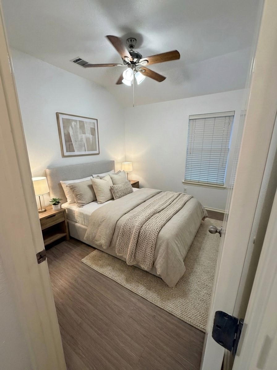 2122 Rachel Lane Round Rock, TX 78664 - Photo 11 of 15 a bedroom with a bed and a ceiling fan