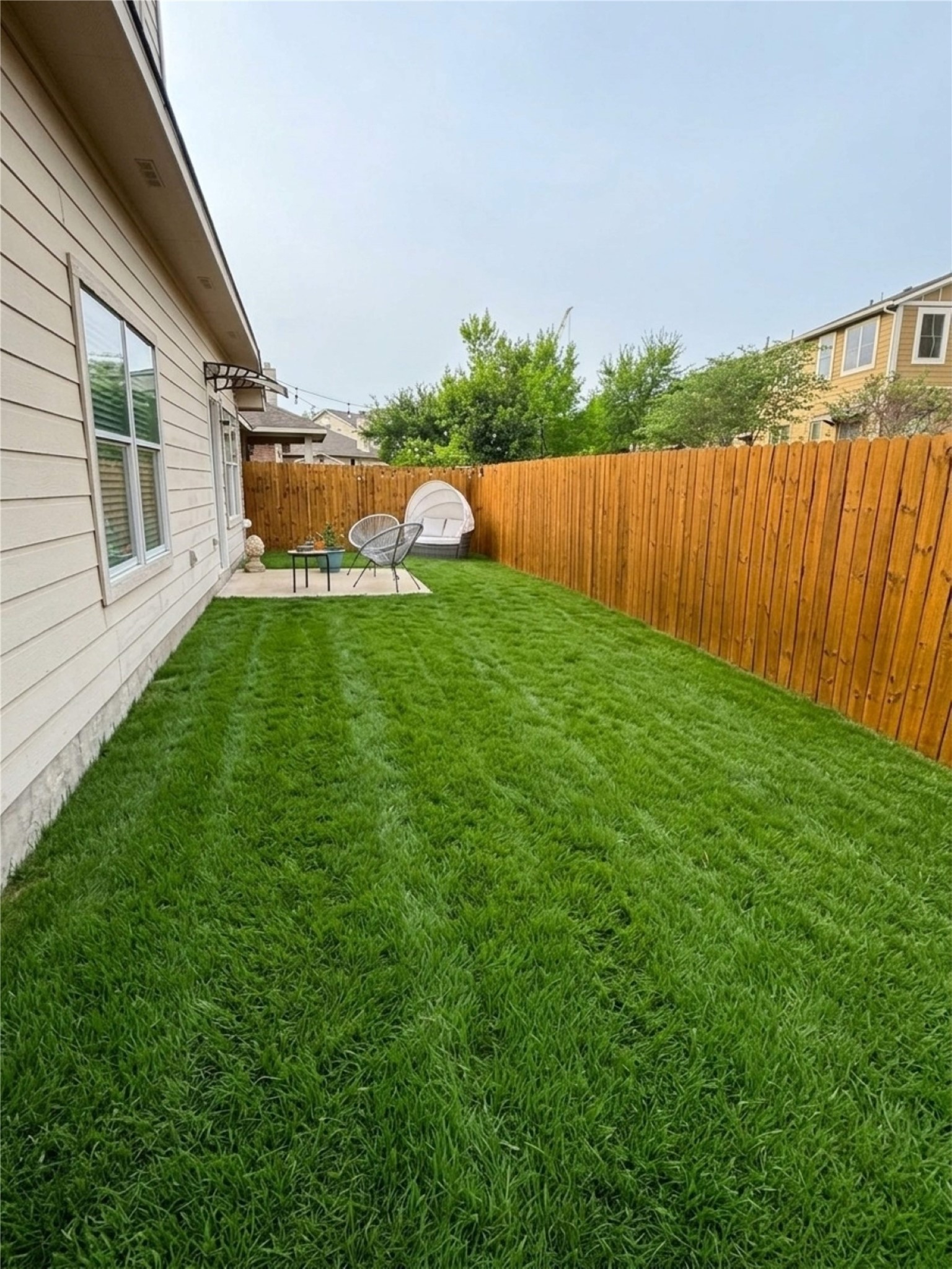 2122 Rachel Lane Round Rock, TX 78664 - Photo 13 of 15 a view of backyard with barbeque and wooden fence