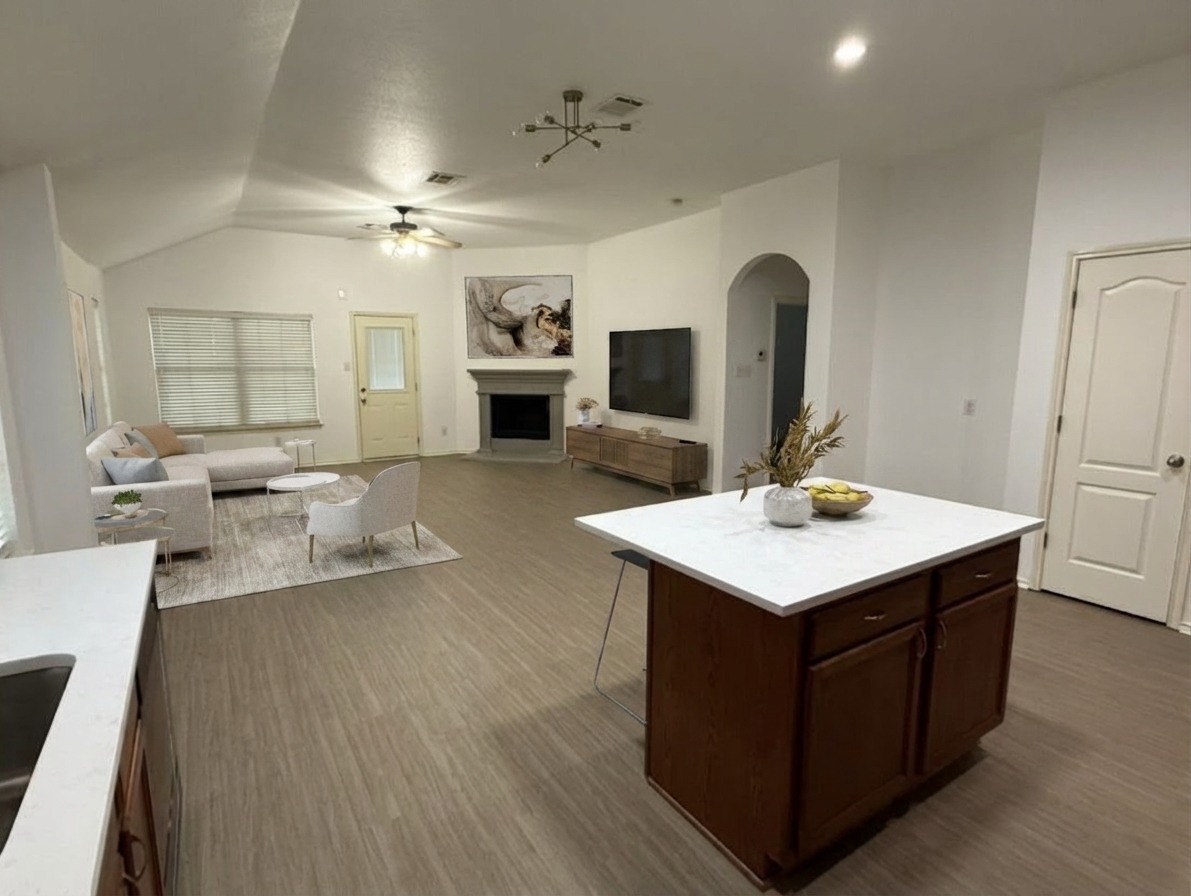 2122 Rachel Lane Round Rock, TX 78664 - Photo 15 of 15 a view of kitchen island with sink wooden floor and living room