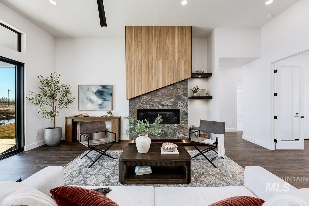 525 Founder Avenue Middleton, ID 83644 - Photo 11 of 50 Living room with dark wood-style flooring, a fireplace, and recessed lighting