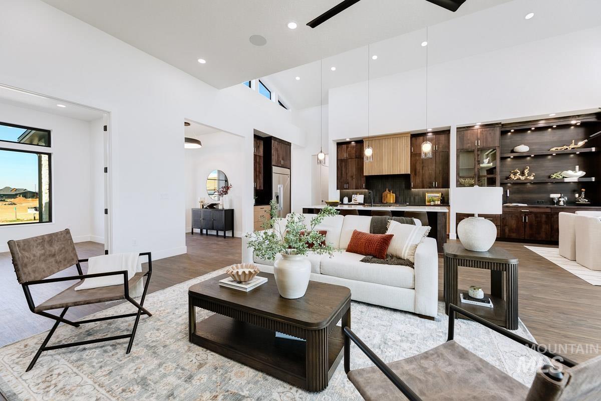 525 Founder Avenue Middleton, ID 83644 - Photo 13 of 50 Living room with recessed lighting, light wood finished floors, a ceiling fan, a high ceiling, and healthy amount of natural light
