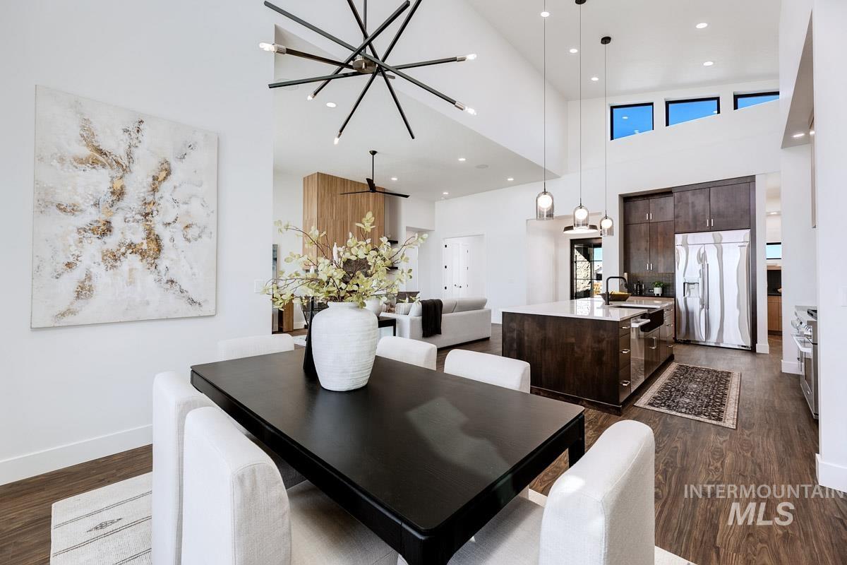 525 Founder Avenue Middleton, ID 83644 - Photo 15 of 50 Dining room with dark wood finished floors, a high ceiling, and recessed lighting