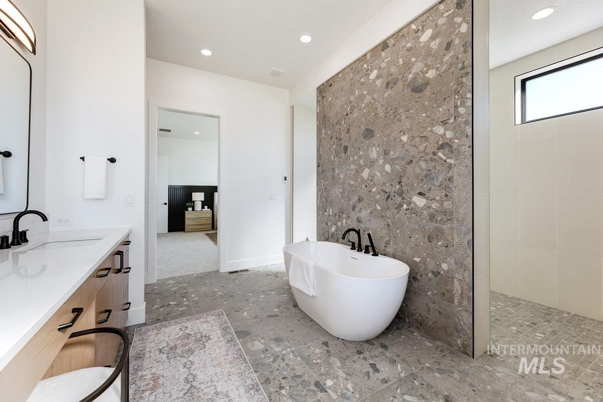 525 Founder Avenue Middleton, ID 83644 - Photo 25 of 50 Bathroom featuring a freestanding bath, vanity, a walk in shower, and recessed lighting