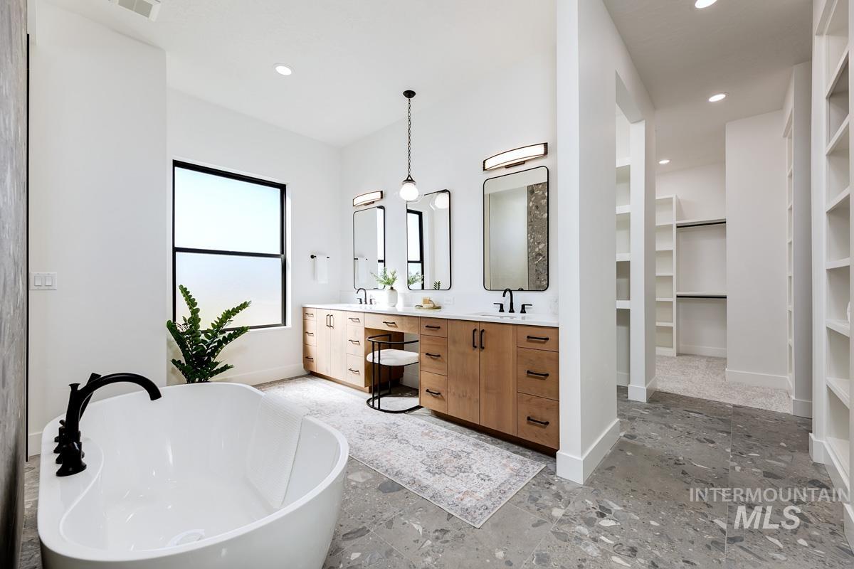 525 Founder Avenue Middleton, ID 83644 - Photo 27 of 50 Full bath featuring double vanity, a freestanding tub, a spacious closet, recessed lighting, and built in shelves