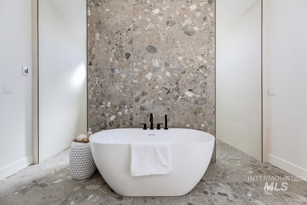525 Founder Avenue Middleton, ID 83644 - Photo 28 of 50 Bathroom featuring a freestanding bath and tile walls