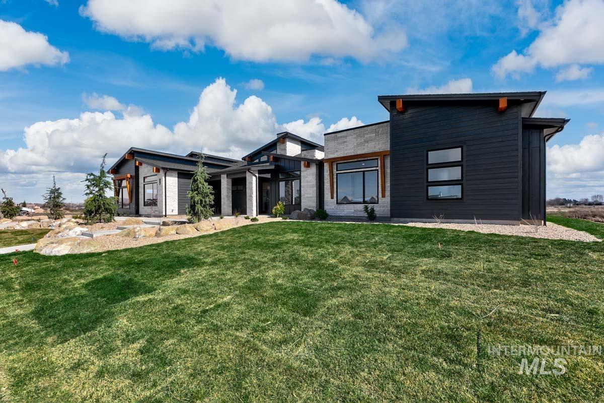 525 Founder Avenue Middleton, ID 83644 - Photo 3 of 50 Modern home featuring a front yard and a patio area