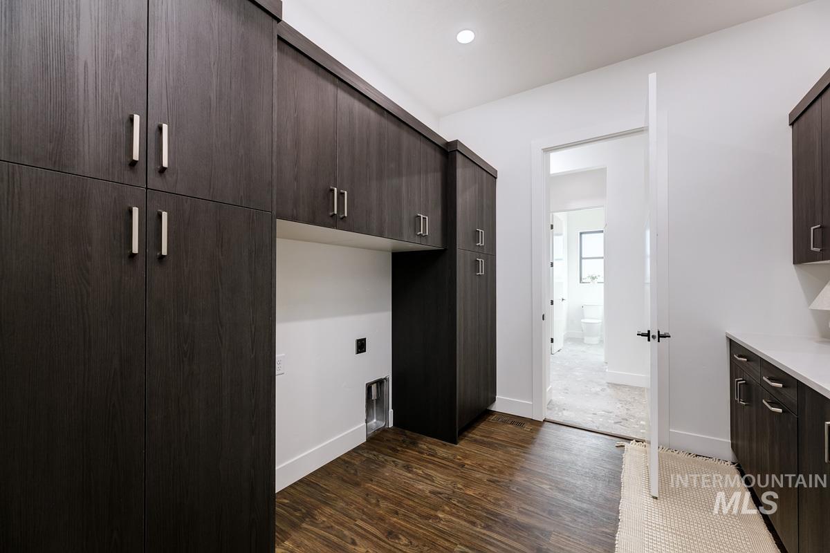 525 Founder Avenue Middleton, ID 83644 - Photo 32 of 50 Laundry room with cabinet space, dark wood finished floors, recessed lighting, and electric dryer hookup