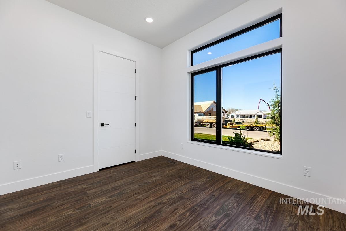 525 Founder Avenue Middleton, ID 83644 - Photo 36 of 50 Empty room featuring dark wood-type flooring and recessed lighting