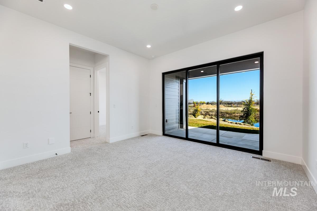 525 Founder Avenue Middleton, ID 83644 - Photo 40 of 50 Empty room featuring light colored carpet and recessed lighting