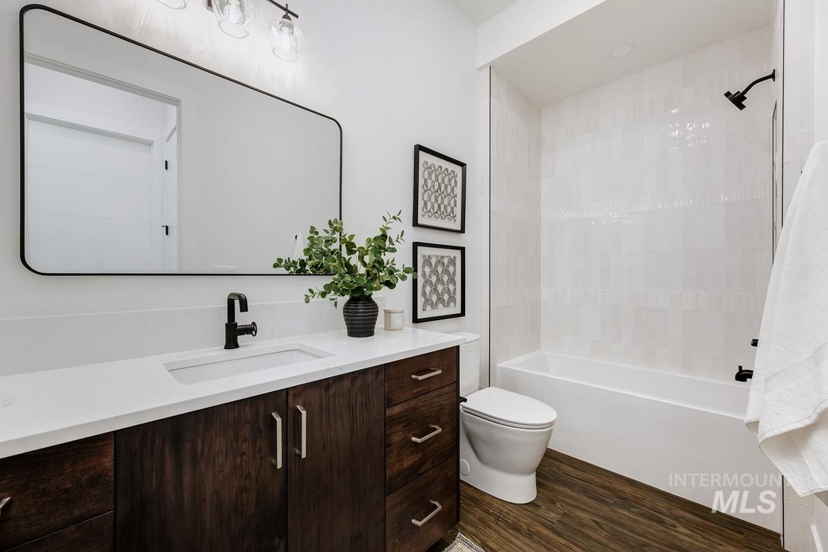 525 Founder Avenue Middleton, ID 83644 - Photo 42 of 50 Full bathroom featuring vanity, shower combination, and dark wood-type flooring