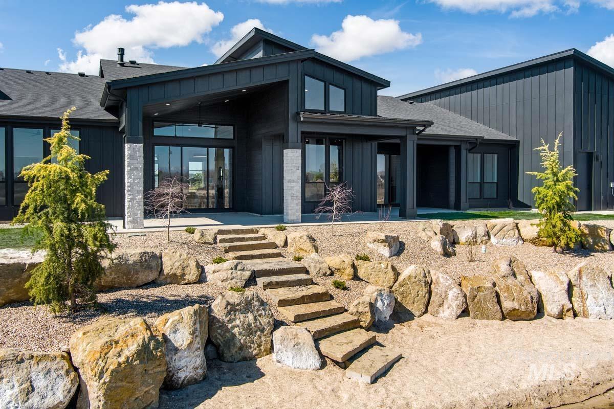 525 Founder Avenue Middleton, ID 83644 - Photo 46 of 50 Rear view of property featuring board and batten siding, a shingled roof, and a patio area