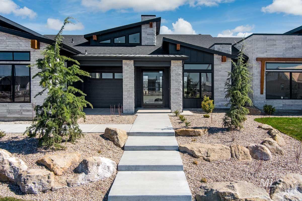 525 Founder Avenue Middleton, ID 83644 - Photo 6 of 50 Doorway to property featuring stone siding and roof with shingles