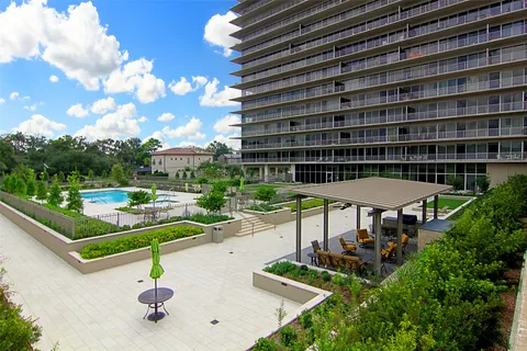 a view of a backyard with sitting area