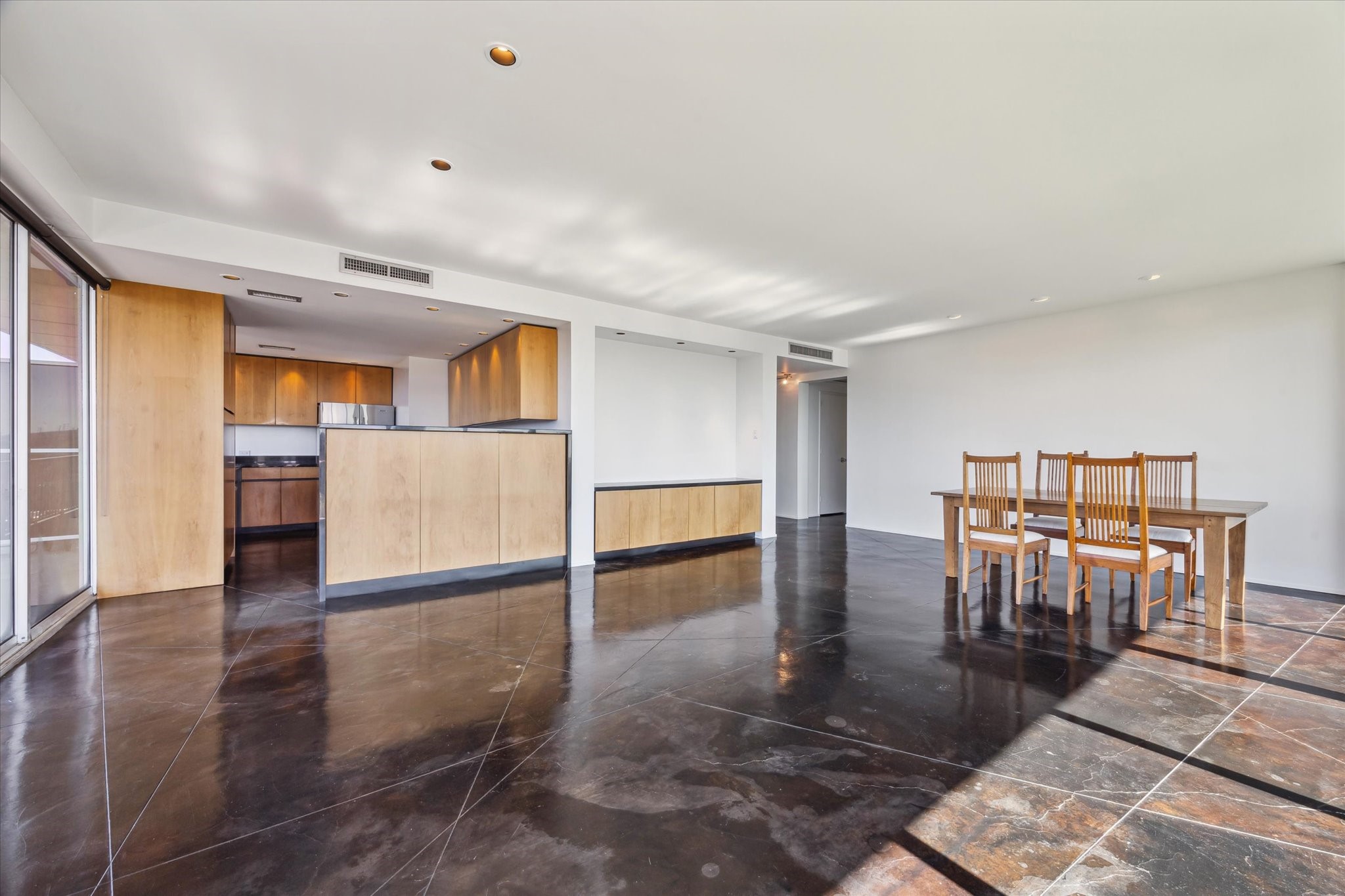 2200 Willowick Road, Unit 11C Houston, TX 77027 - Photo 13 of 14 a view of kitchen with furniture and wooden floor